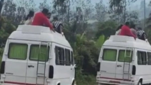 ട്രാവലറിന്റെ മുകളിൽ കയറി ചൂരൽ മലയിലേക്ക് വിനോദസഞ്ചാരികളുടെ അപകട യാത്ര