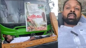 
                        ടാറ്റ ഷോറൂമിന് മുന്നിൽ ശവപ്പെട്ടിയിൽ കിടന്ന്  പ്രതിഷേധിച്ച് ബസുടമ